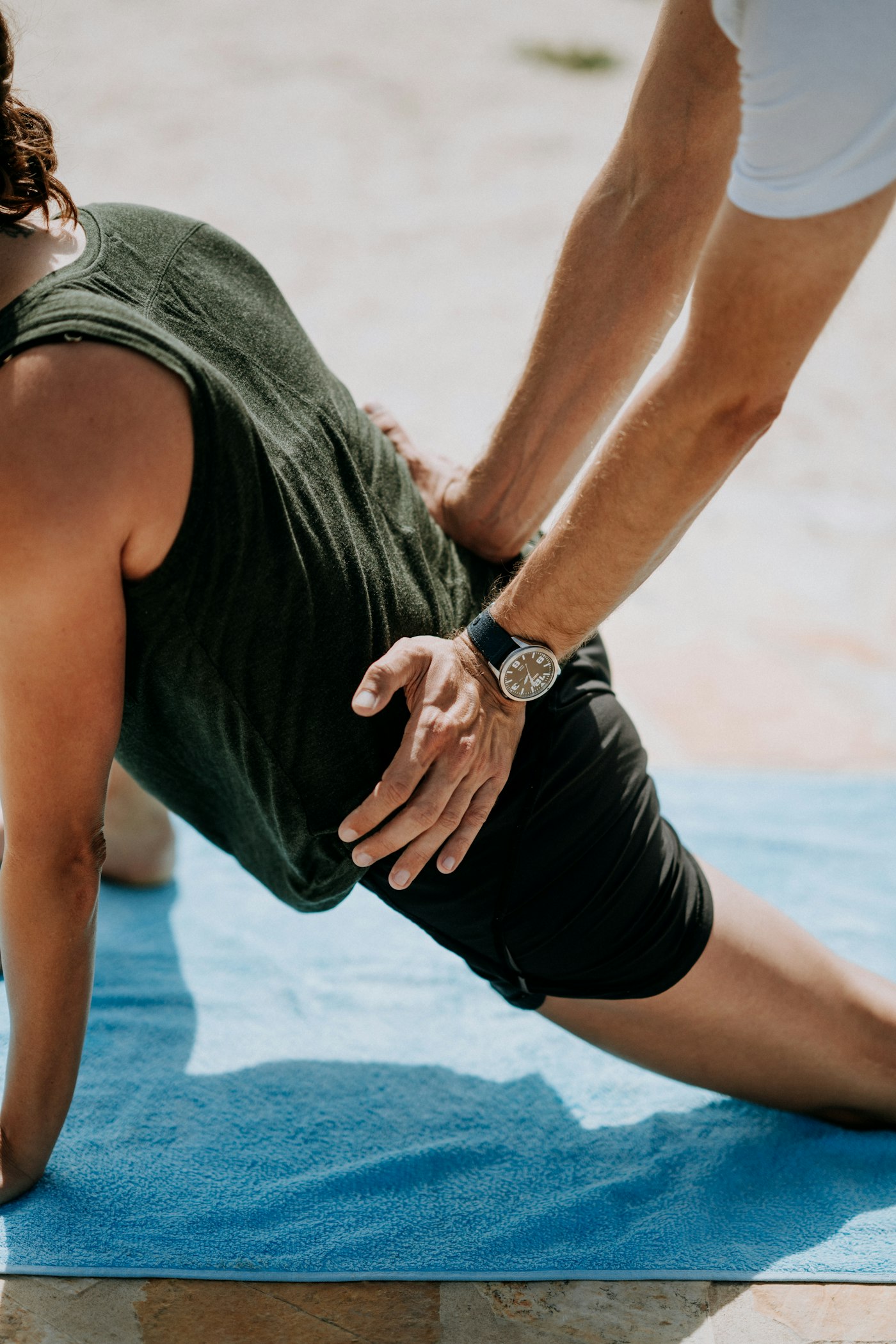 A physiotherapist applying hands-on treatment to a patient's back